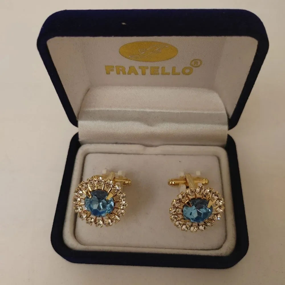 MEN'S FRATELLO GOLD CUFFLINKS WITH BLUE STONE SURRONDED WITH RHINESTONES.